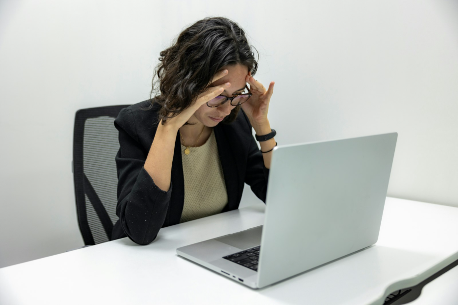 When Redesigns Fail article cover: stressed digital team member at a laptop after a website relaunch